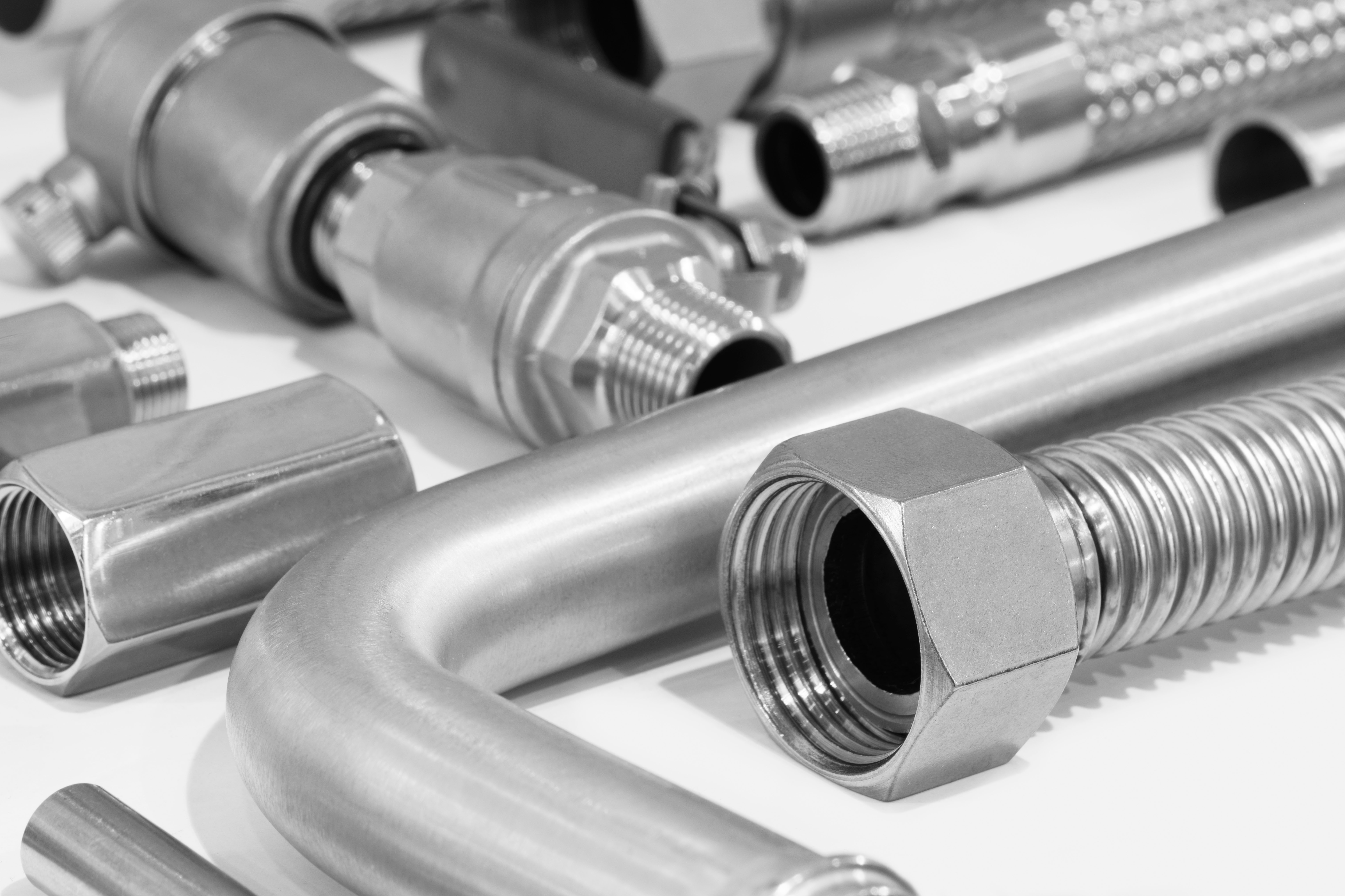 Stainless steel flexible pipes, close-up mackro. Plumbing fixtures and piping parts, Industrial metal concept